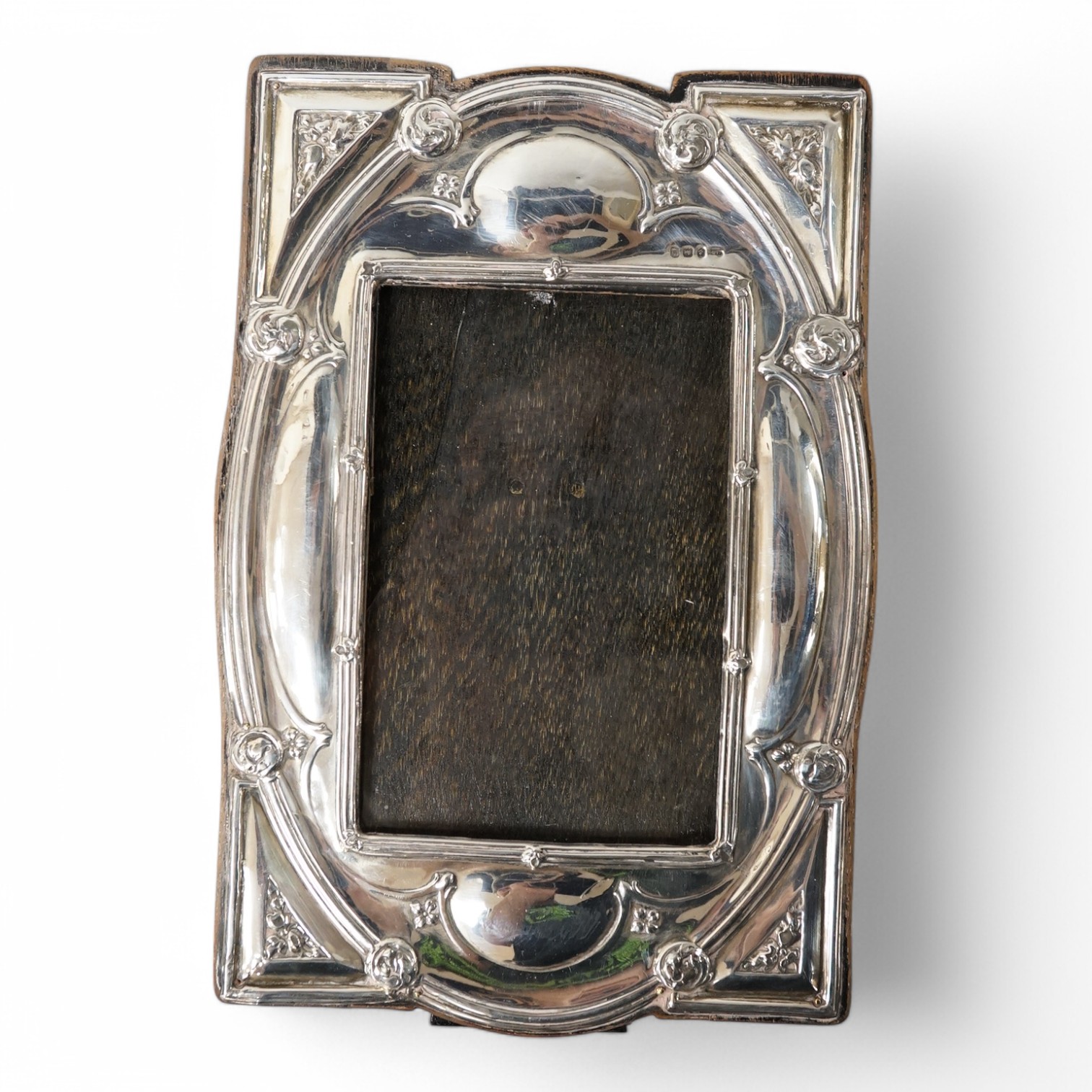 An Edwardian Art Nouveau silver mounted photograph frame, by J. Atkin & Son, Birmingham, 1909, 24.7cm. Condition - poor to fair